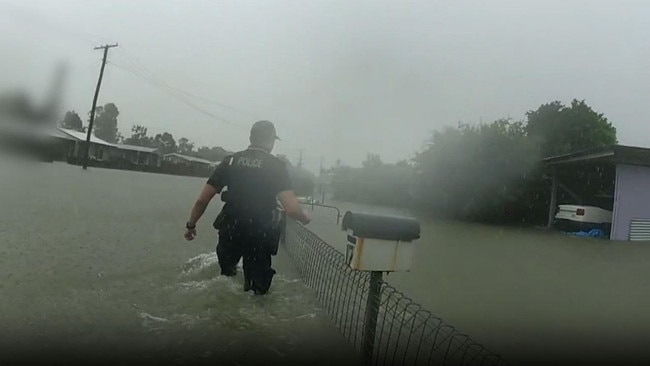 Officers rescue Gordonvale residents from flash flood on Thursday.