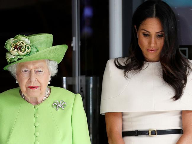 Queen Elizabeth and Meghan observe a moment of silence in memory of the victims of the Grenfell Tower fire disaster during their visit to Cheshire on June 14, 2018. Picture: AFP