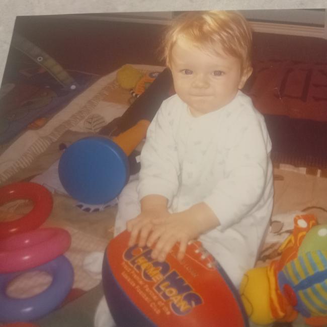 Tyler Welsh with a Crows footy as a baby.