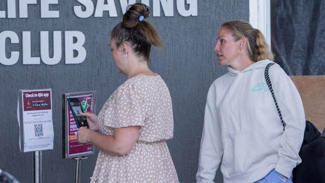 Patrons checking into the the Surfers Paradise Surf Life Saving Club on the first day of the Queensland Government’s vaccine mandate roll out. Picture: Jerad Williams