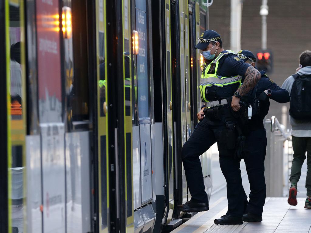 PSO officers get on a Melbourne tram in Lonsdale Street. Picture: Sarah Matray