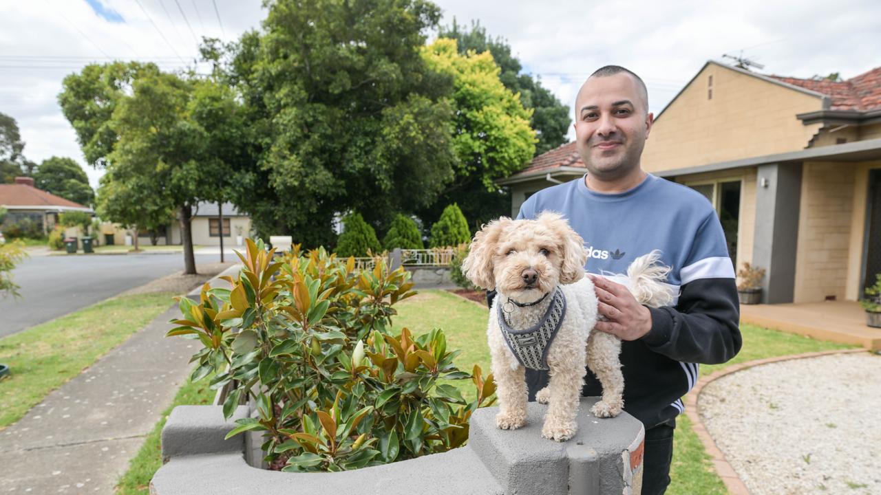 York Ave resident Sam Kazerani and his dog Theodore outside their Clovely Park home that will be demolished because of the South Rd upgrade. Picture: NCA NewsWire / Brenton Edwards