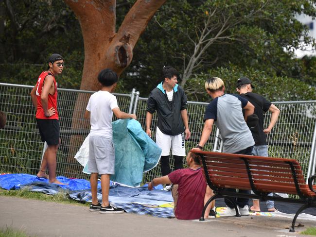 People are seen setting up at Mrs Macquarie's Point in preparation for New Years Eve Fireworks in Sydney, Monday, December 31, 2018. Picture: AAP / Brendan Esposito