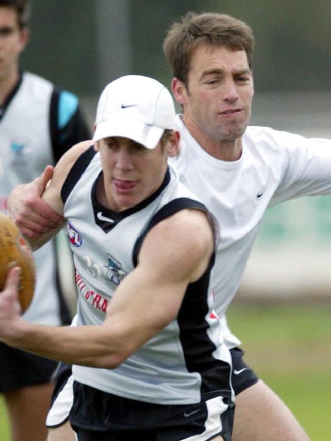 Then Port Adelaide assistant Alastair Clarkson gets involved in a drill at training.