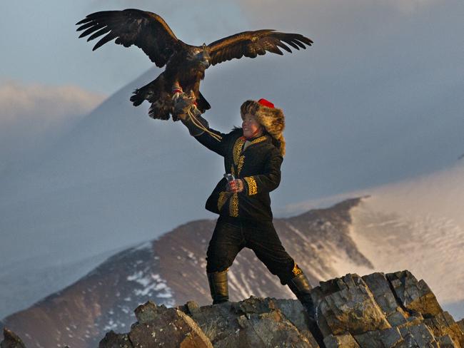 Aisholpan learns to train the eagle in front of a natural spectacular backdrop. Picture: Asher Svidensky