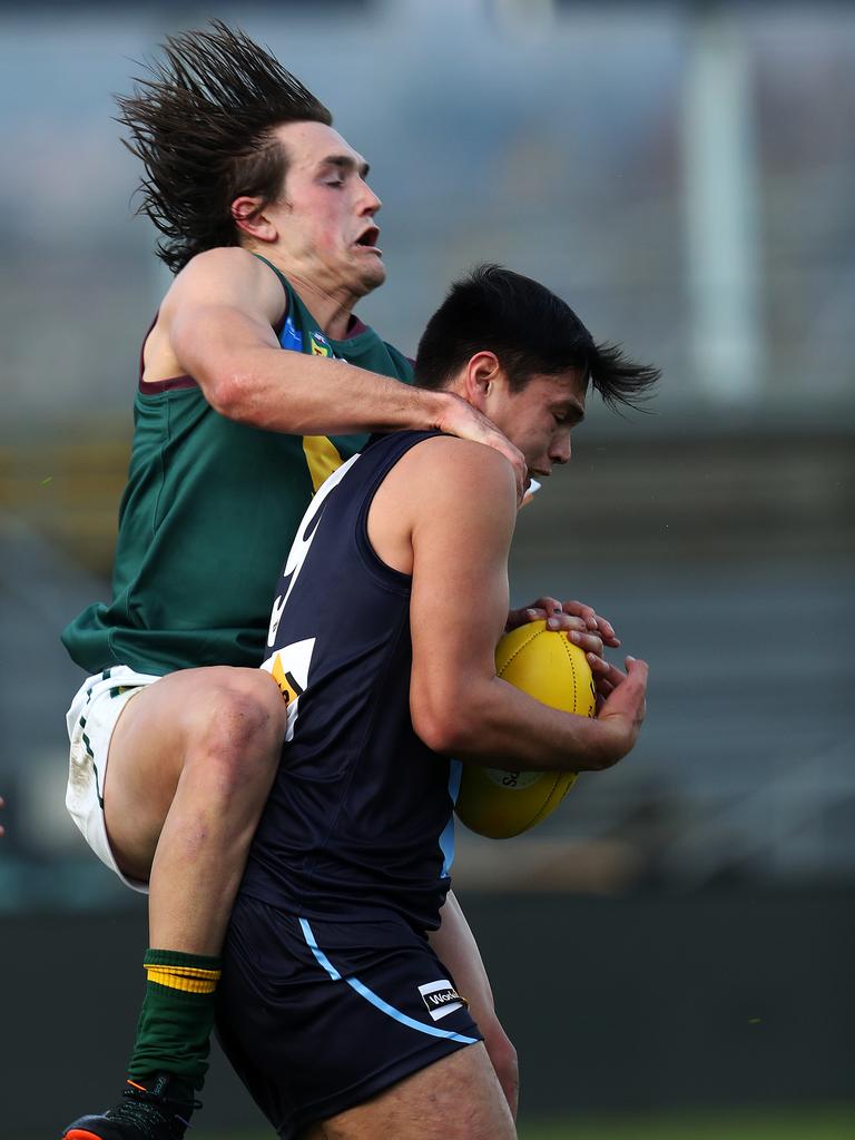 Tasmania Aiden Grace and Vic Metro Joseph Fisher contest a mark during the game against Vic Metro at UTAS Stadium. PICTURE CHRIS KIDD