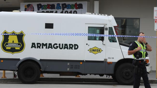 Shoppers have told of their terror after a man armed with a shotgun held up an Armaguard van at Waverley Gardens Shopping Centre this morning. Picture: Alex Coppel.