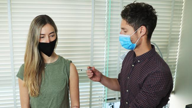 Gabi Blomson receives the AstraZeneca Covid jab from Dr Stephen Massey in Sydney this week. Picture: John Feder