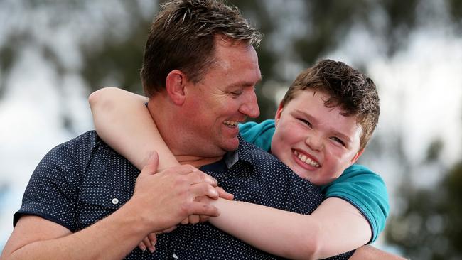 Layton Smith, 12, pictured with his father Troy at RAAF Memorial Park in Mt Druitt. For Public Defender.