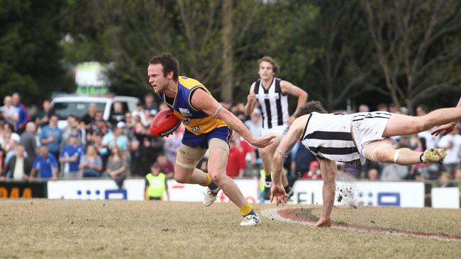 Craig Anderson avoids a tackle, proving he always was a hard man to bring down. Picture: Supplied.