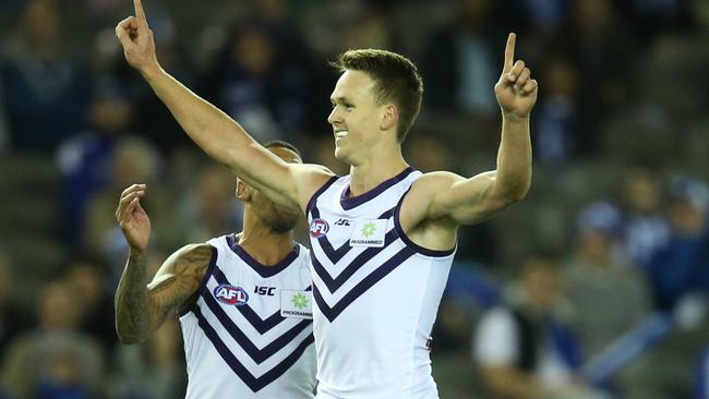 Ryan Nyhuis celebrates after scoring a goal for the Dockers.