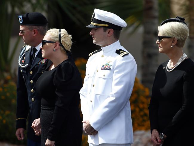 Cindy McCain, right, stands with her children Jimmy, Meghan and Jack McCain. Picture: AP