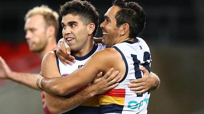 Tyson Stengle of the Crows celebrates his goal with Eddie Betts.