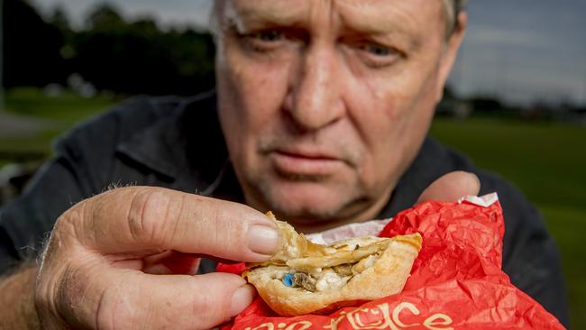 Brett Smith with a Pie Face pie he says he purchased from the United servo. Picture: Jerad Williams