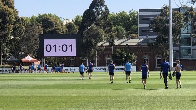 North Melbourne players are on the clock at Arden St. Pics: Jay Town