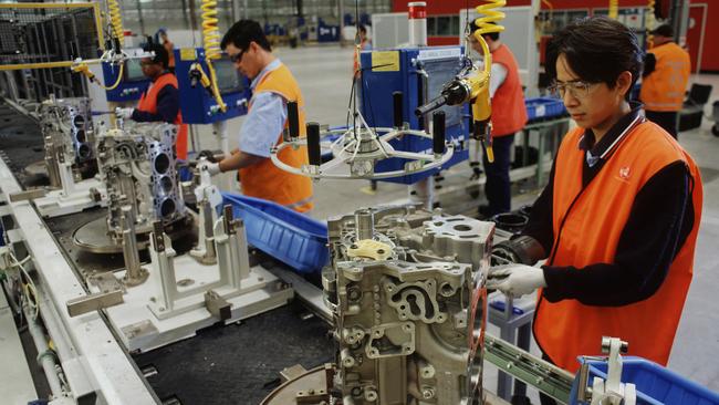 One million and counting ... Holden V6 engine plant workers in Port Melbourne.