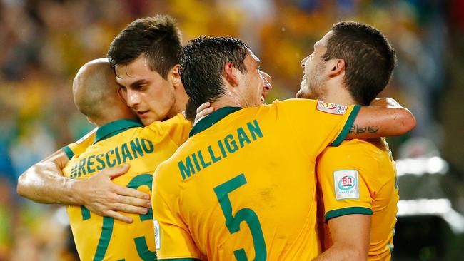 SYDNEY, AUSTRALIA - JANUARY 13: Tomi Juric of Australia celebrates with teammates after scoring during the 2015 Asian Cup match between Oman and Australia at ANZ Stadium on January 13, 2015 in Sydney, Australia. (Photo by Daniel Munoz/Getty Images)