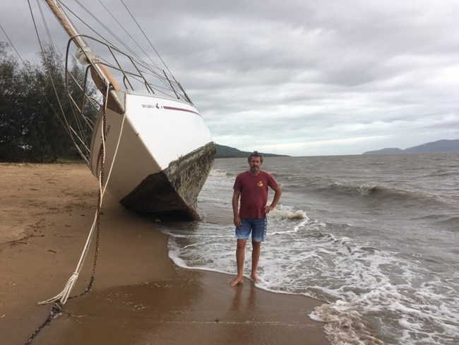 Tropical Cyclone Kirrily 2024: Peter Bright, owner of Skylark 3 checks on his boat after it became unmoored.
