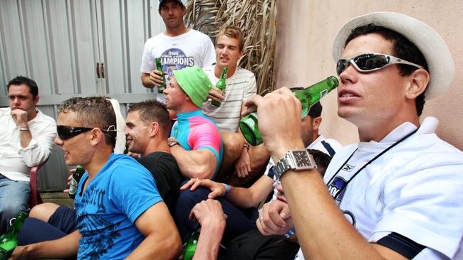 Hearfield (right) celebrates an A League premiership with Newcastle Jets teammates at a private party.