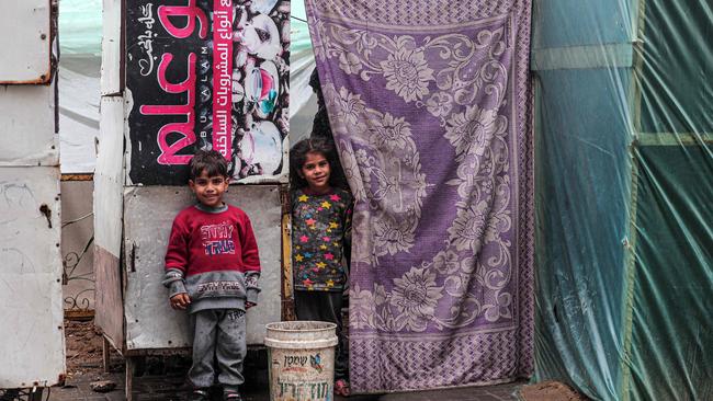 Displaced Palestinian children stand in front of a tent in Rafah in the southern Gaza Strip. Picture: AFP