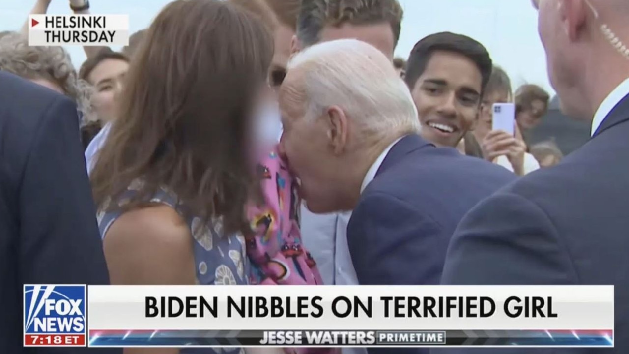 The president nibbled the little girl's shoulder. Picture: Fox News