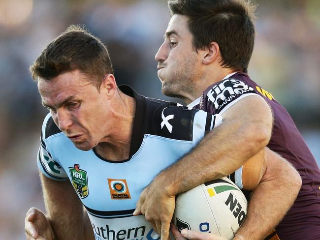 SYDNEY, AUSTRALIA - MAY 01: James Maloney of the Sharks is tackled by Ben Hunt of the Broncos during the round nine NRL match between the Cronulla Sharks and the Brisbane Broncos at Southern Cross Group Stadium on May 1, 2016 in Sydney, Australia. (Photo by Matt King/Getty Images)