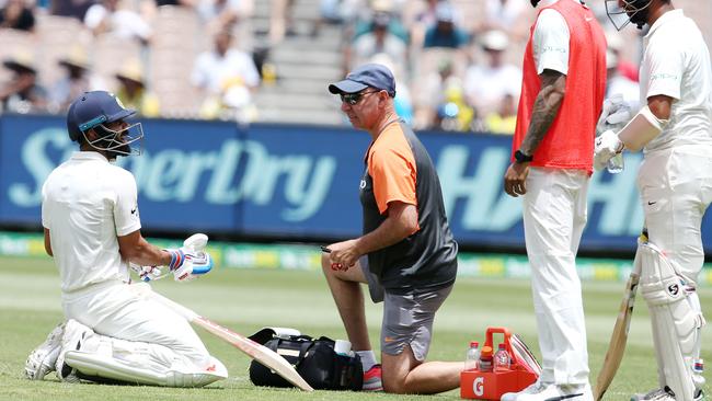 Boxing Day test match. Day 2. Australia vs India at the MCG. Virat Kohli of India with team physio Pat Farhart just after lunch . Pic: Michael Klein