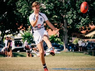 Aiden Fyfe warming up to play for the Broadbeach Cats QAFL team. Picture credit: Brooke Sleep Photography.