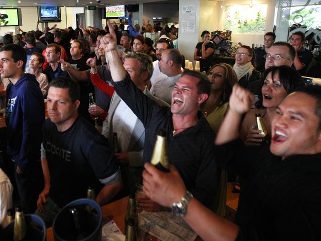 Punters enjoy their win while watching the Melbourne Cup at Clovelly Hotel.