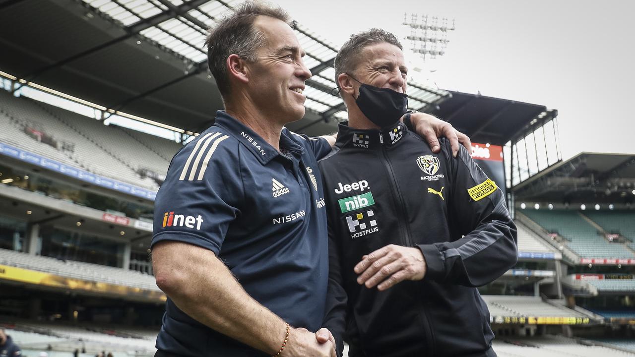 MELBOURNE, AUSTRALIA - AUGUST 21: Hawthorn Senior coach Alastair Clarkson and Richmond senior coach, Damien Hardwick shake hands after the round 23 AFL match between Richmond Tigers and Hawthorn Hawks at Melbourne Cricket Ground on August 21, 2021 in Melbourne, Australia. (Photo by Darrian Traynor/Getty Images)