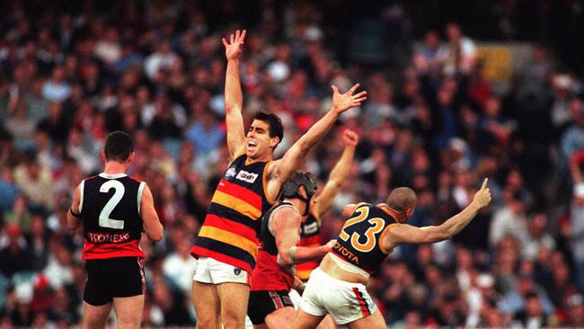 Darren Jarman (and Andrew McLeod celebrate the 1997 grand final win