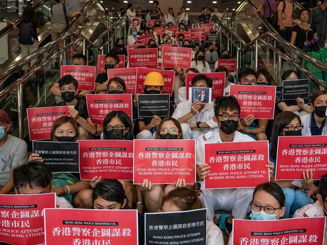 Members of the medical profession gather to protest against Hong Kong police brutality at Queen Elizabeth Hospital on August 13. Picture: Getty Images