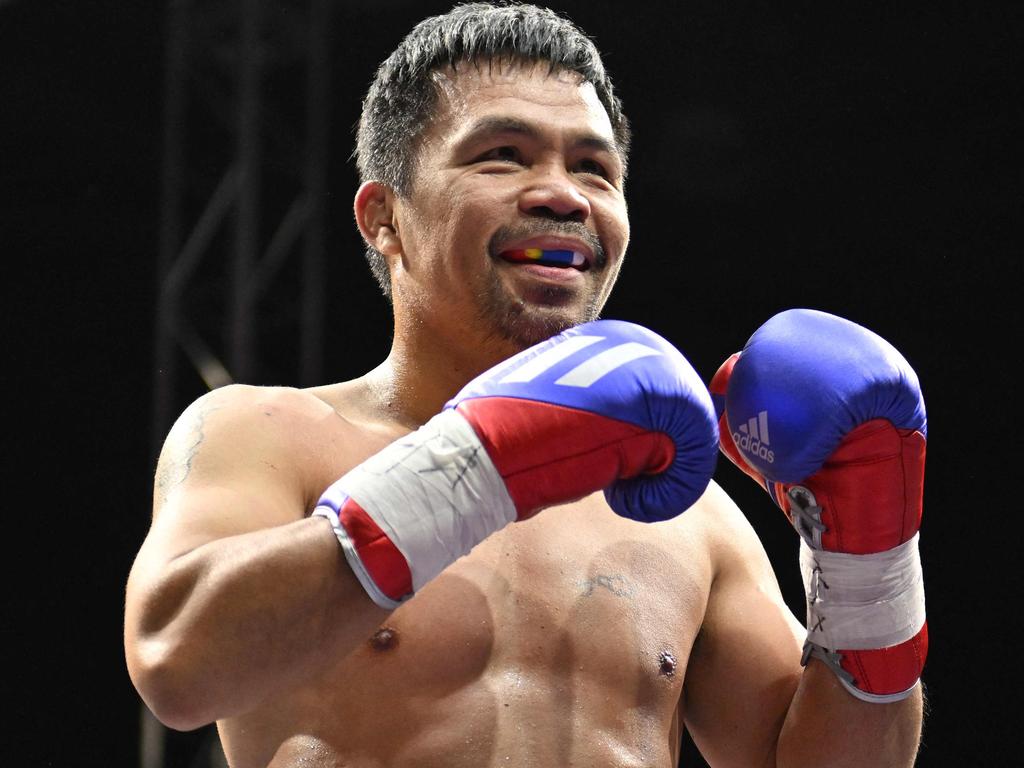 Pacquiao (R) in December 2022. Picture: Jung Yeon-je / AFP