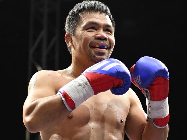 Pacquiao (R) in December 2022. Picture: Jung Yeon-je / AFP