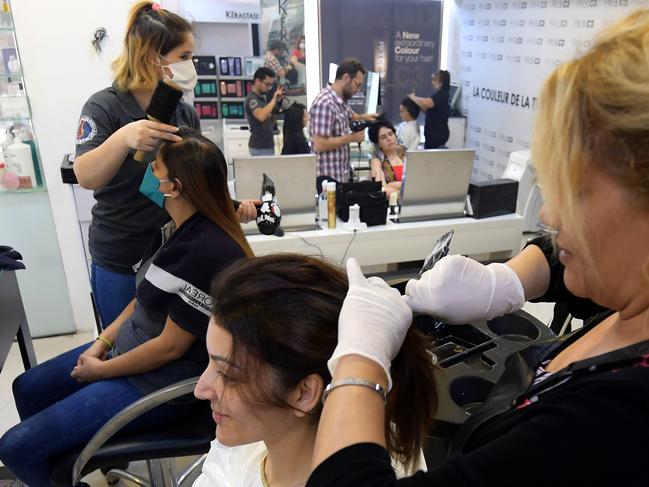 Beauty saloons are roaring back to life around the world with easing of lock downs. Picture: AFP