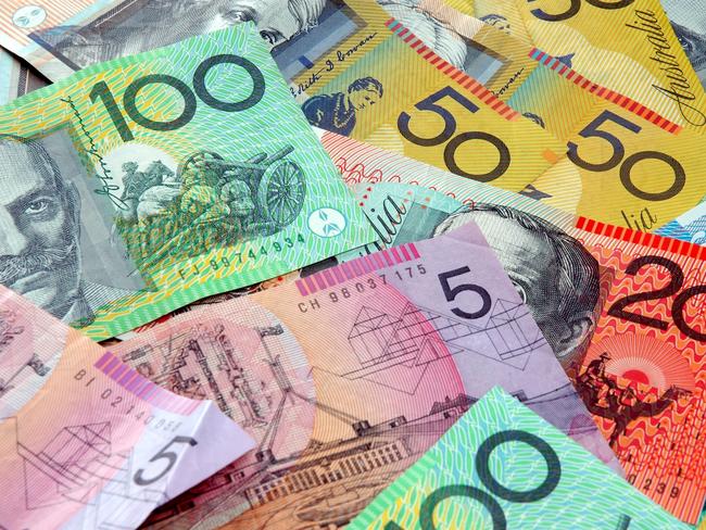 Australian notes scattered on a table. Notes, currency, generic money