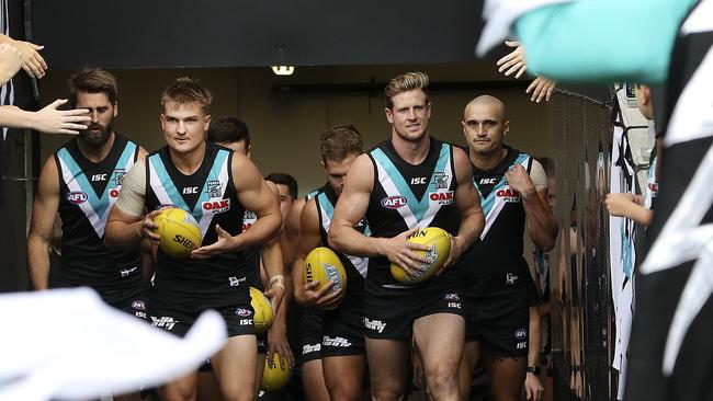 Dual captains Ollie Wines and Tom Jonas lead the team out this season. Picture SARAH REED