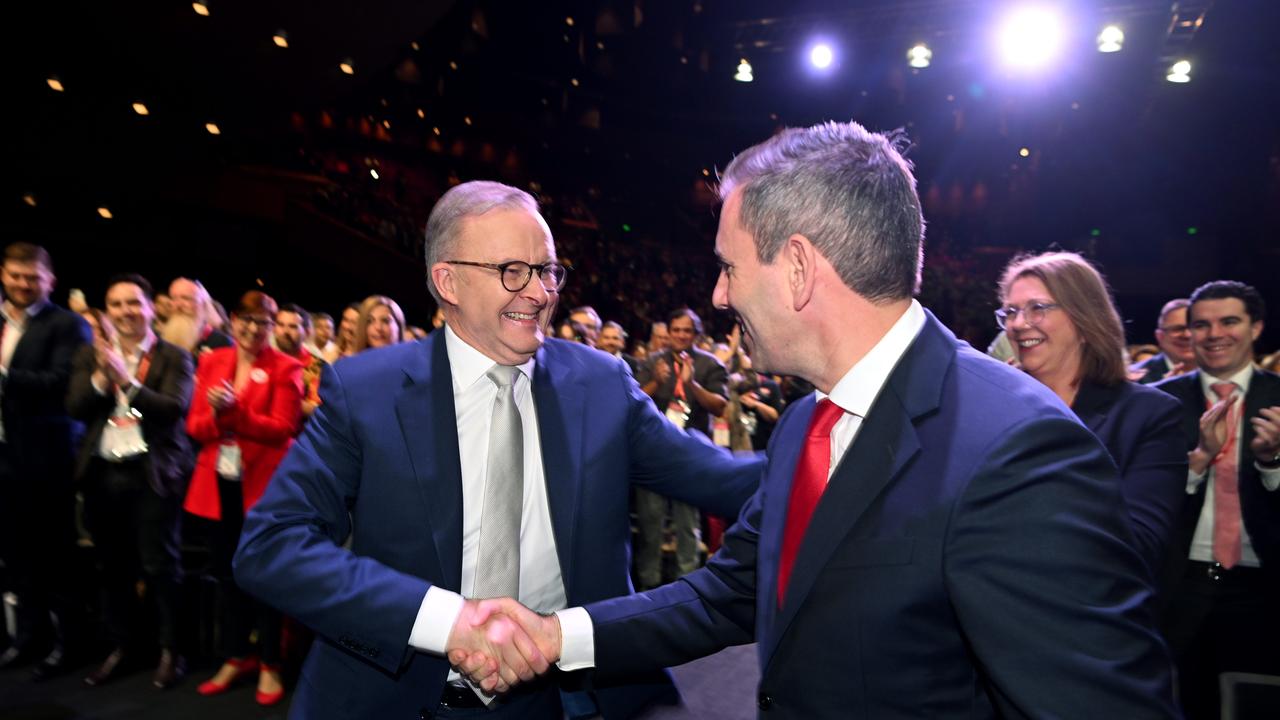 Mr Albanese shakes hands with the Treasurer as he made his way to the podium. Picture: Dan Peled / NCA NewsWire