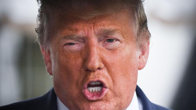 Then US President Donald Trump speaks to the press before departing the White House in Washington, DC. Picture: AFP