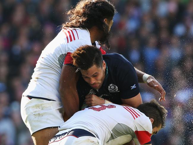 LEEDS, ENGLAND - SEPTEMBER 27: Sean Maitland of Scotland is tackled by Thretton Palamo (L) and Seamus Kelly of the United States during the 2015 Rugby World Cup Pool B match between Scotland and USA at Elland Road on September 27, 2015 in Leeds, United Kingdom. (Photo by Jan Kruger/Getty Images)