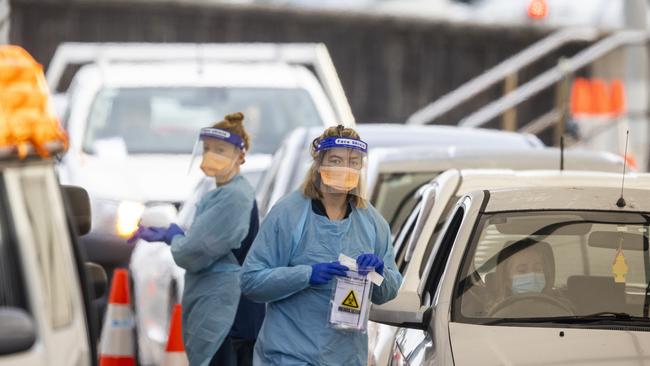 Health workers are seen at Bondi Beach Drive-through COVID-19 Clinic on June 23. (Photo by Jenny Evans/Getty Images)