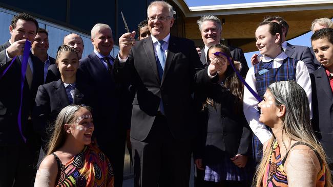 Prime Minister Scott Morrison cuts the ribbon to officially open the Western Sydney International Experience Centre.