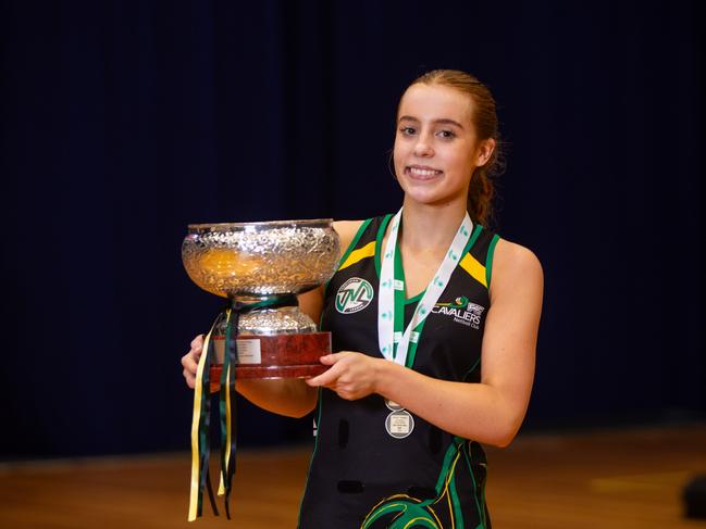 Cavliers centre and U19 grand final MVP Ava Lockwood-Roden with her medal and the premiership trophy at Launceston's Silverdome after defeating Cripps. Picture: PATRICK GEE/SUPPLIED