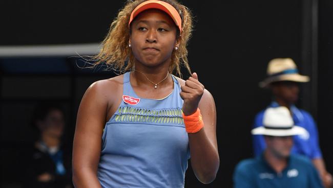 Naomi Osaka celebrates after win over Ash Barty.