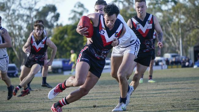 Devon Meadows player Trent Cody with the ball on Saturday. Picture: Valeriu Campan