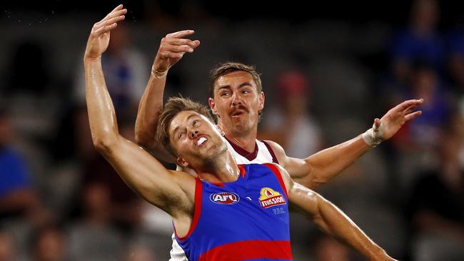 Josh Schache tries to get the better of Joe Daniher.