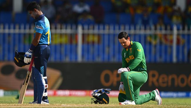 Quinton De Kock of South Africa takes the knee ahead of the ICC Men's T20 World Cup match between South Africa and Sri Lanka at Sharjah Cricket Stadium on October 30, days after refusing a team directive to do so. Picture: Alex Davidson/Getty Images