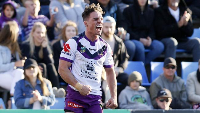 Brodie Croft celebrates scoring a try for the Storm.