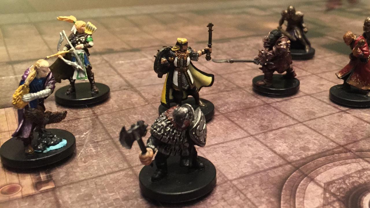 Character pieces on a Dungeons and Dragon's 'encounter' board play out a battle.