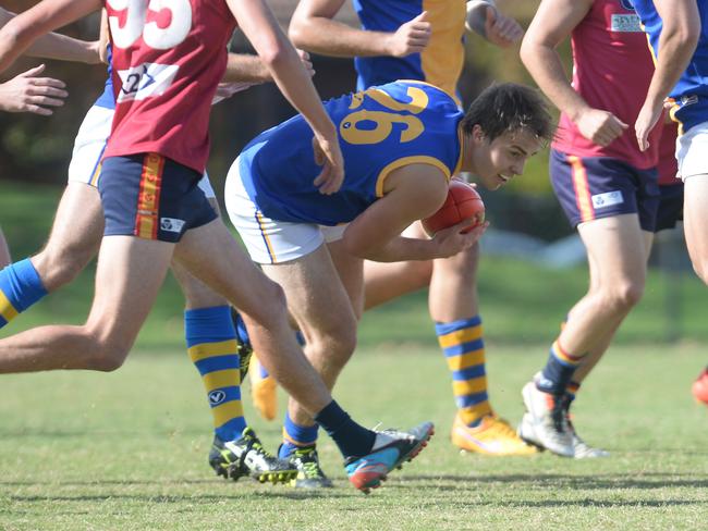 s43pp204 VAFA (premier) football Old Scotch (red) v DeLa Salle (blue). DeLa Salle Brendan Close 26 with the ball. Picture: Susan Windmiller